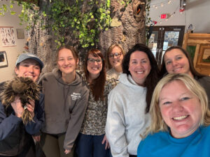 Seven individuals are pictured facing the camera